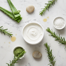 Flat lay of rosemary lotion with natural ingredients