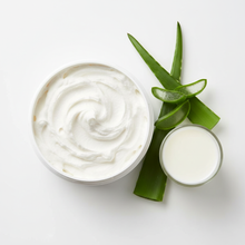 Overhead view of extra fluffy goat milk lotion with aloe and milk