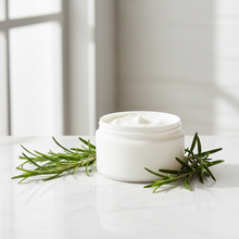 Rosemary lotion base with fresh rosemary sprigs